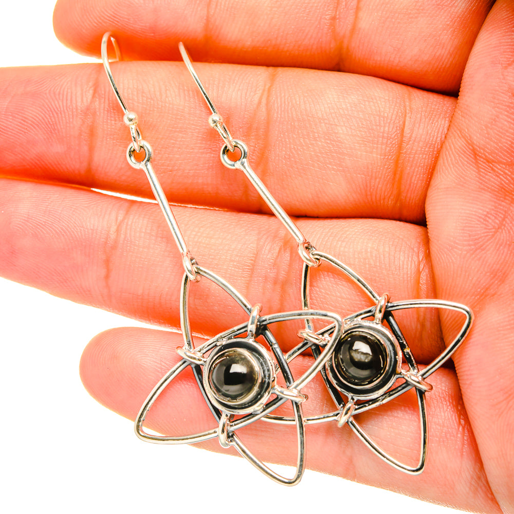 Star diopside earrings in sterling silver, long dangle with black cabochon detail