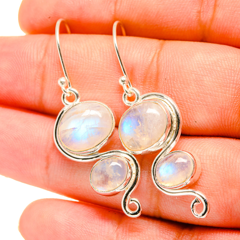 925 sterling silver moonstone earrings, close-up of oval opalescent stones on hooks