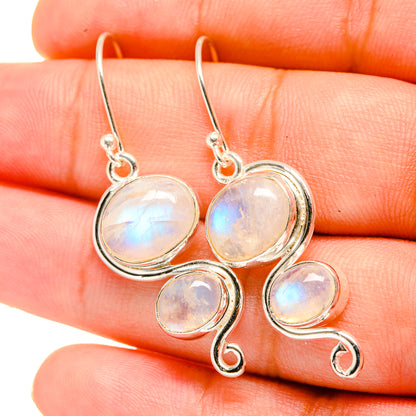 925 sterling silver moonstone earrings, close-up of oval opalescent stones on hooks