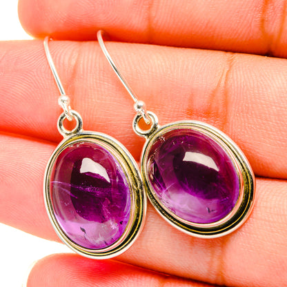 Oval amethyst drop earrings, 925 sterling silver oval stones with dark purple faceted glow.