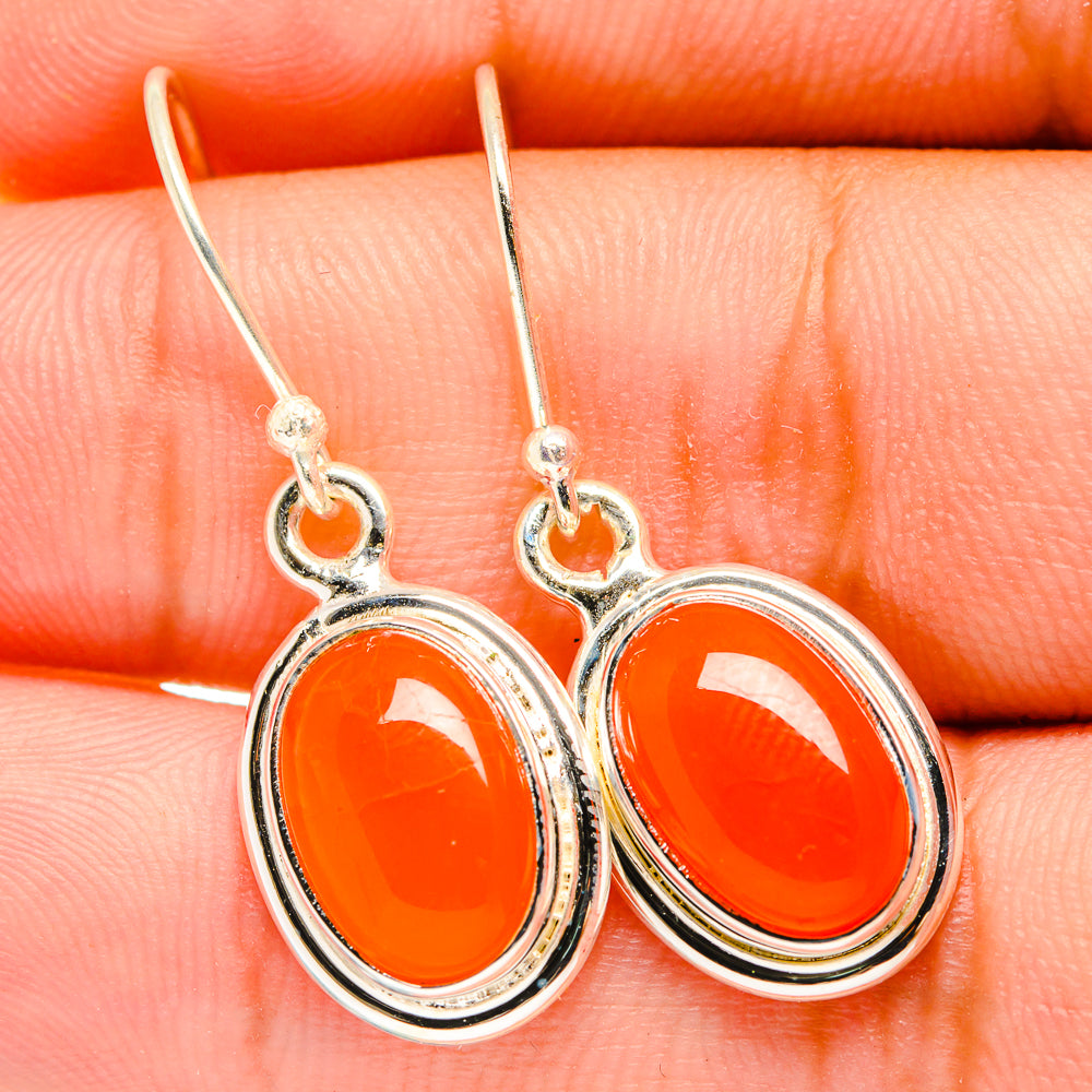 Carnelian dangle earrings, oval orange cabochon set in silver-tone frames with hooks