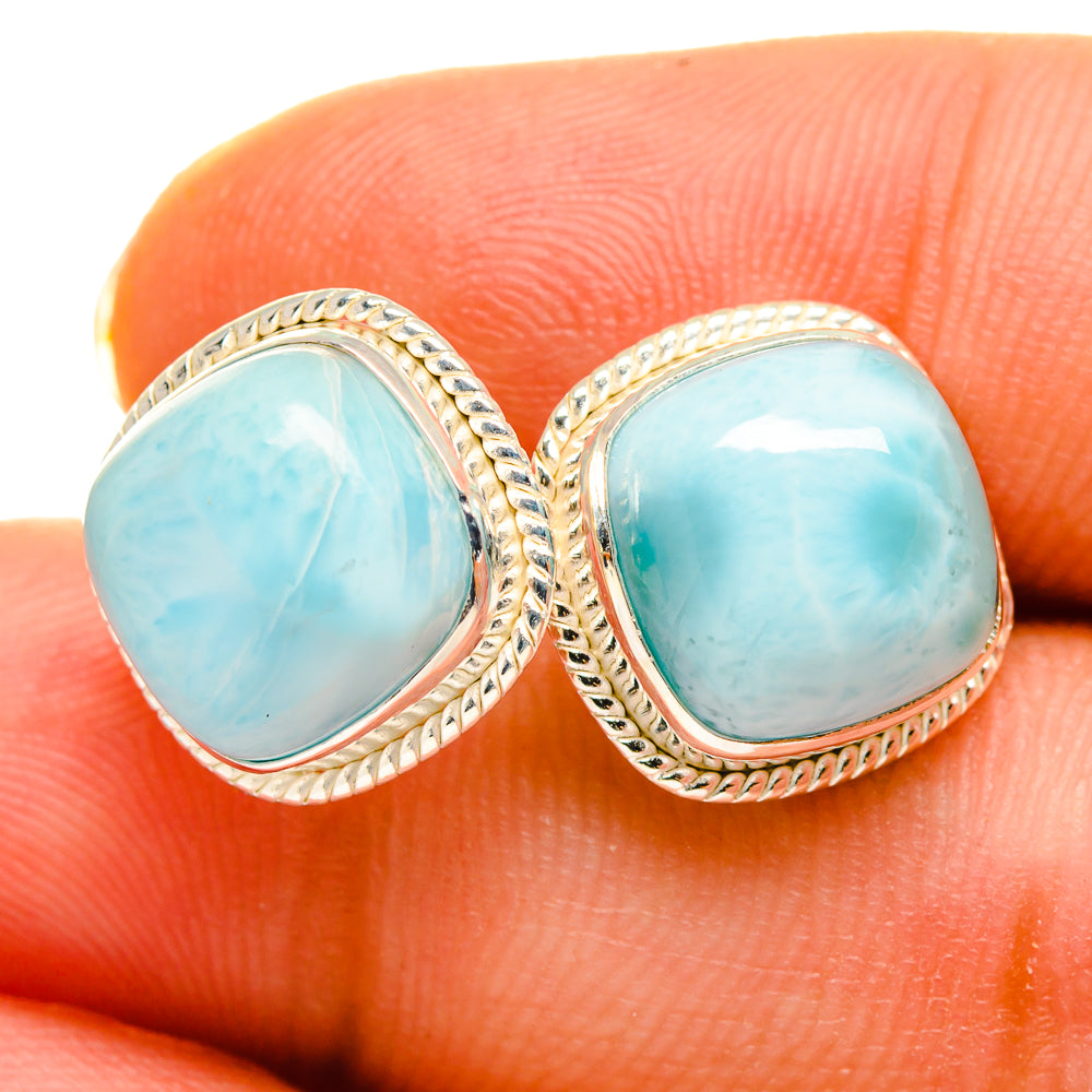 Sterling silver Larimar stud earrings with oval light-blue stones and rope bezel.