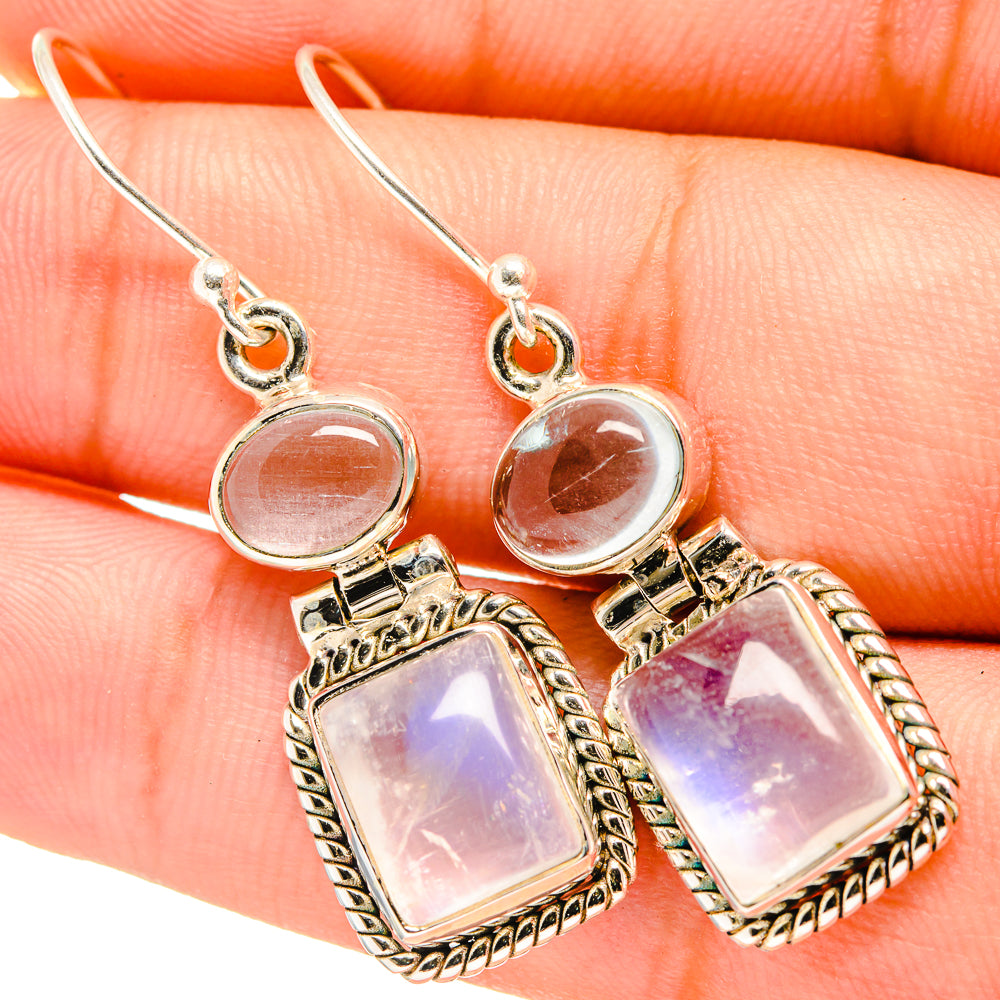 Sterling silver drop earrings with pink-purple opalescent square stones and round tops