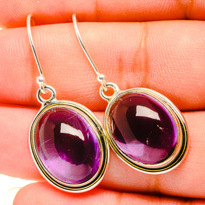 Amethyst oval drop earrings, purple gemstone in silver bezel with slim hook