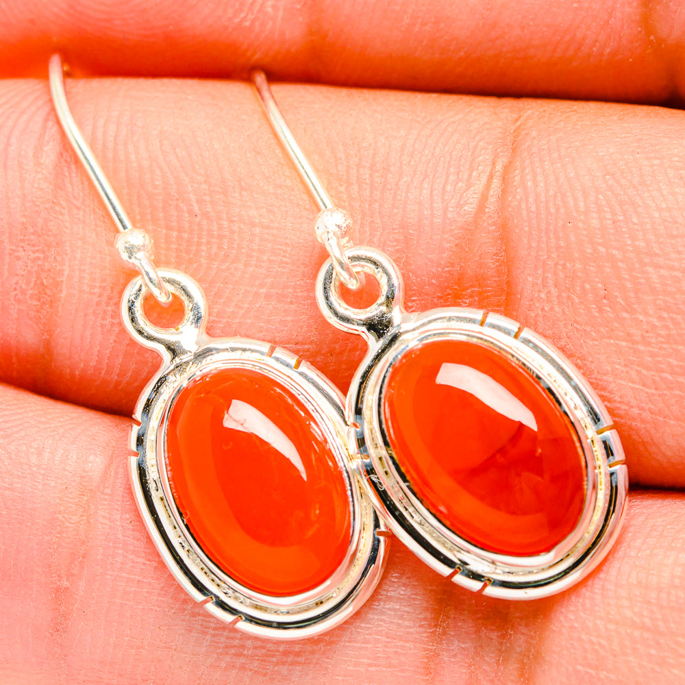 Oval orange carnelian drop earrings in 925 sterling silver, fishhook with bezel setting