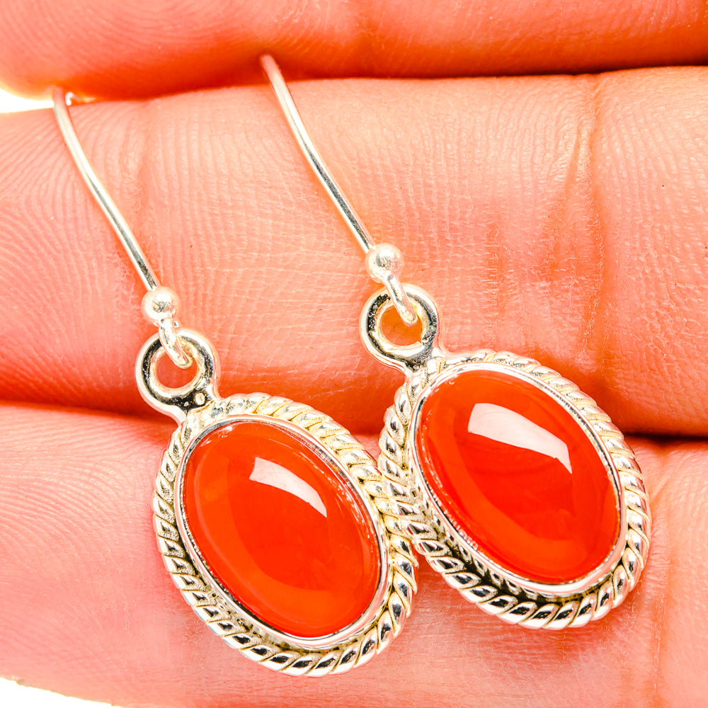 925 sterling silver earrings with red-orange oval carnelian cabochons and hooked drop