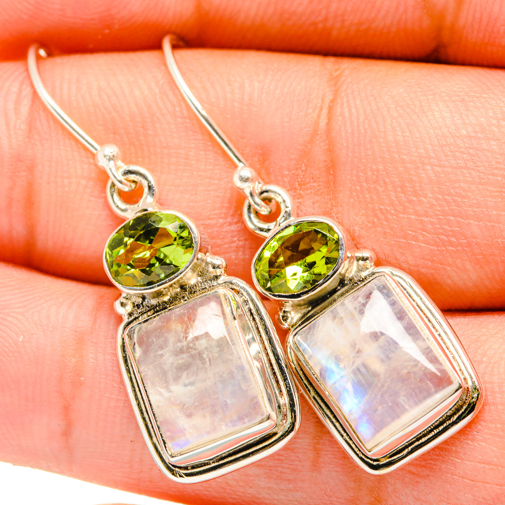 Sterling silver earrings closeup: green peridot and iridescent moonstone rectangular drops