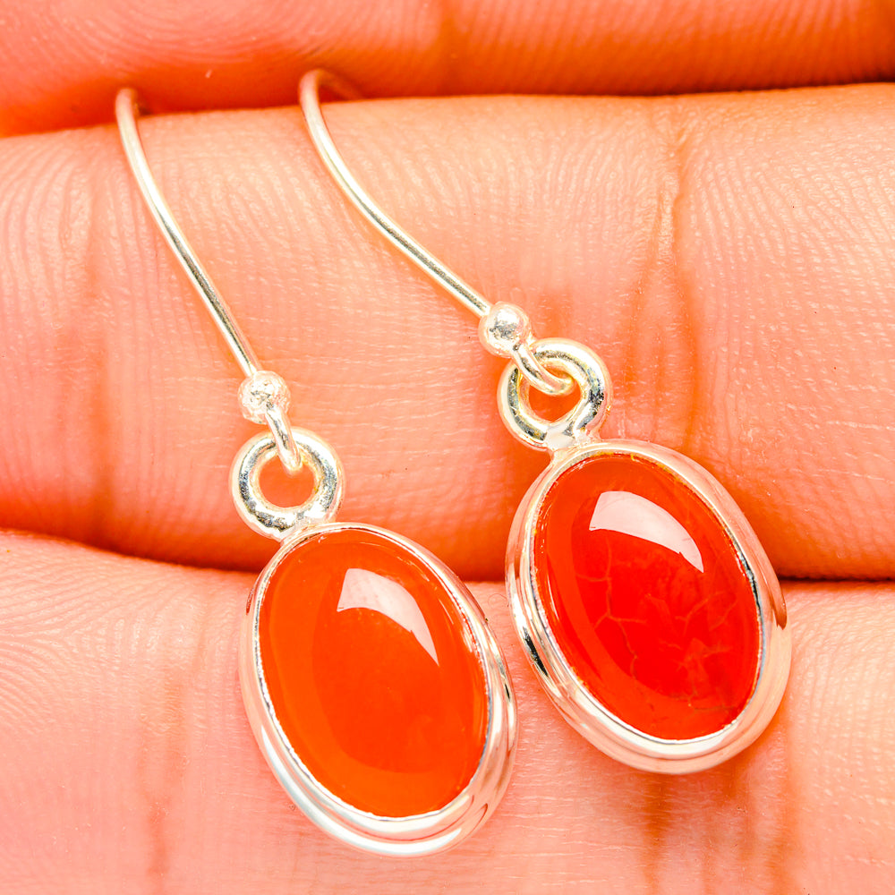 Oval orange carnelian drop earrings with sterling silver loops and cabochons