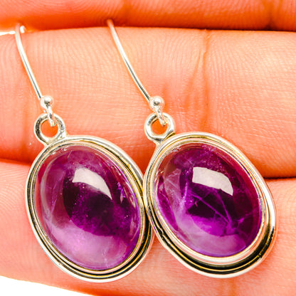 Amethyst drop earrings, 925 sterling silver, oval purple gemstone, close-up