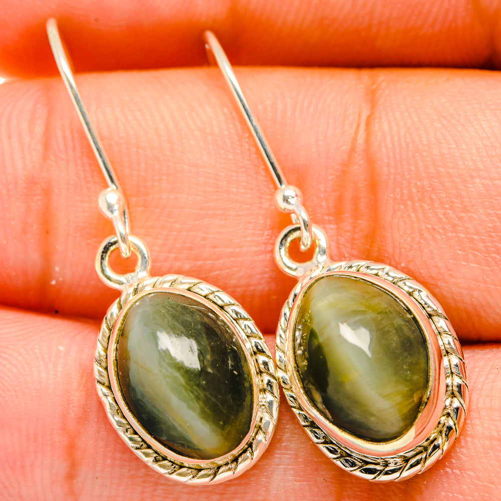 Sterling silver cat’s eye drop earrings with oval green stone and ornate rope bezel