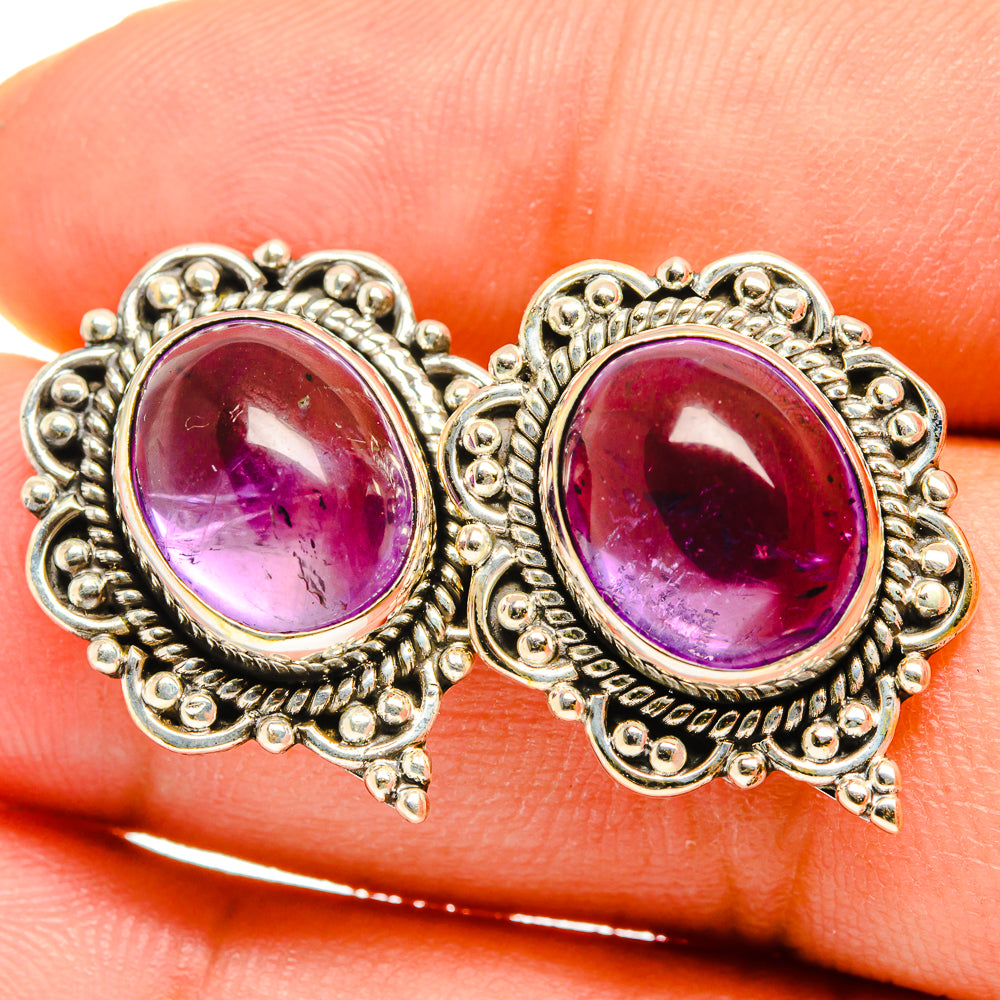 Amethyst 925 sterling silver stud earrings with oval purple gemstones and ornate bezel