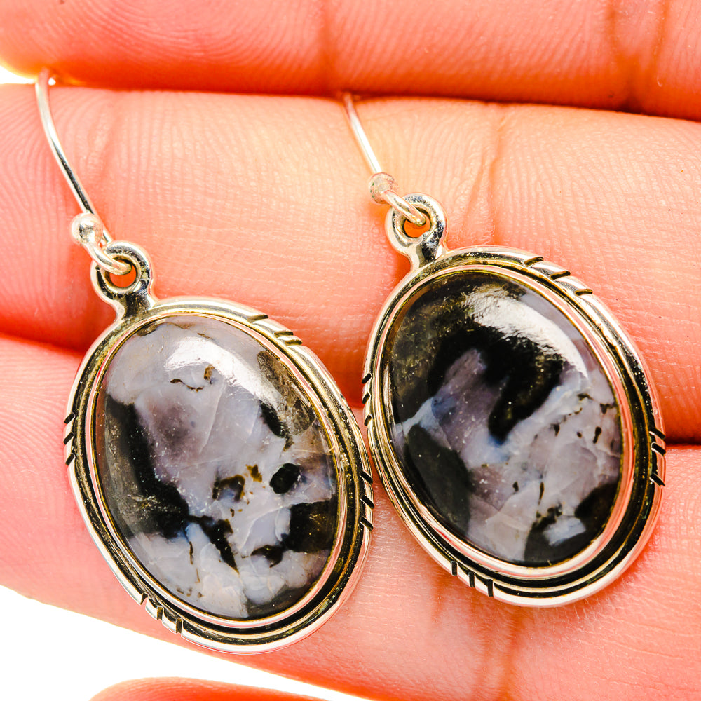 Oval gabbro stone earrings with gold-tone bezels, dark stone with white streaks
