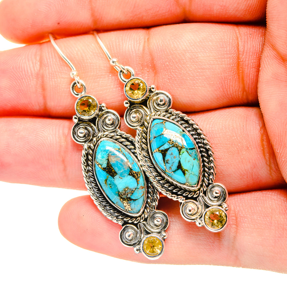 Turquoise and yellow gemstone drop earrings with oval blue stones and silver hooks