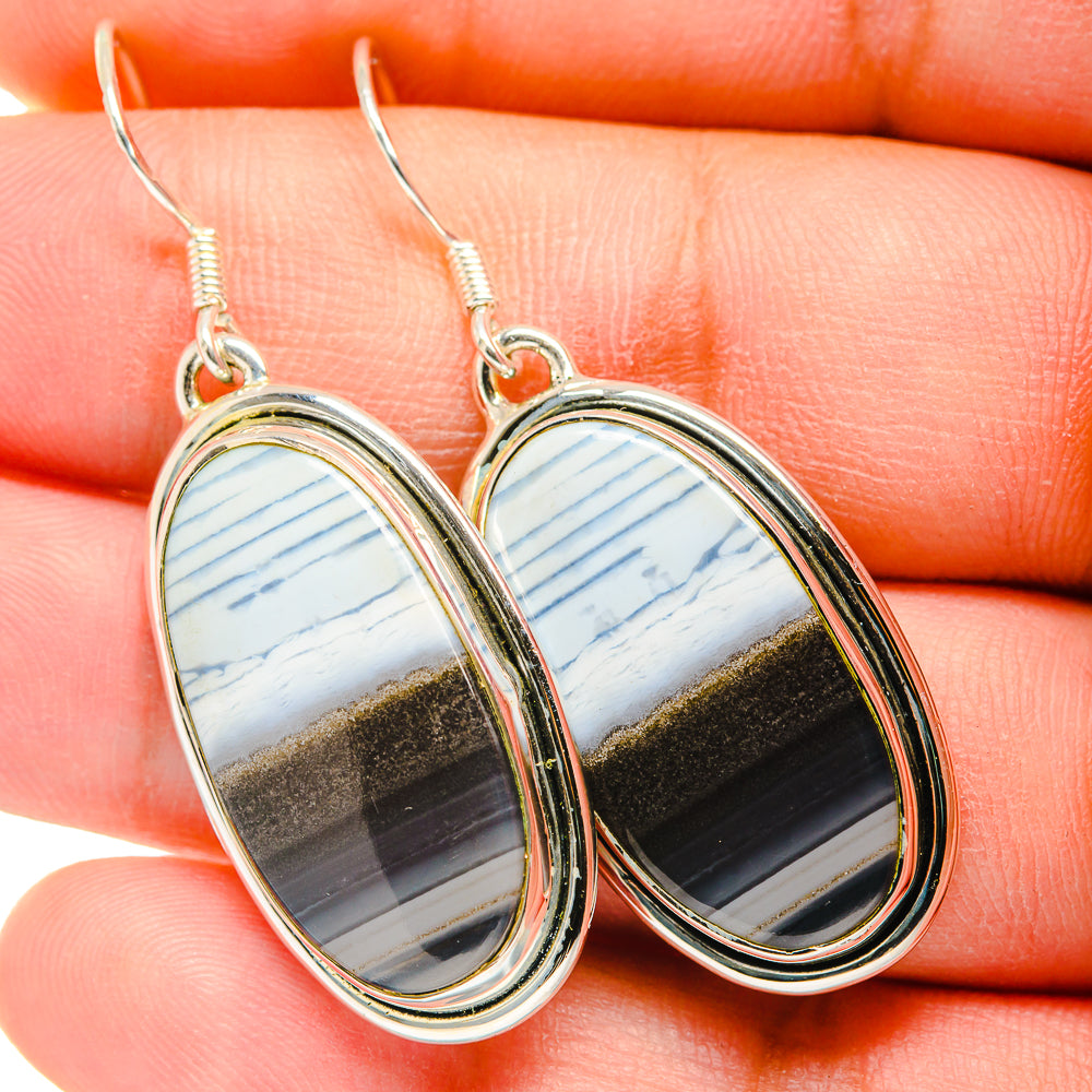 Sterling silver oval drop earrings with blue-white and gold-brown opal inlay