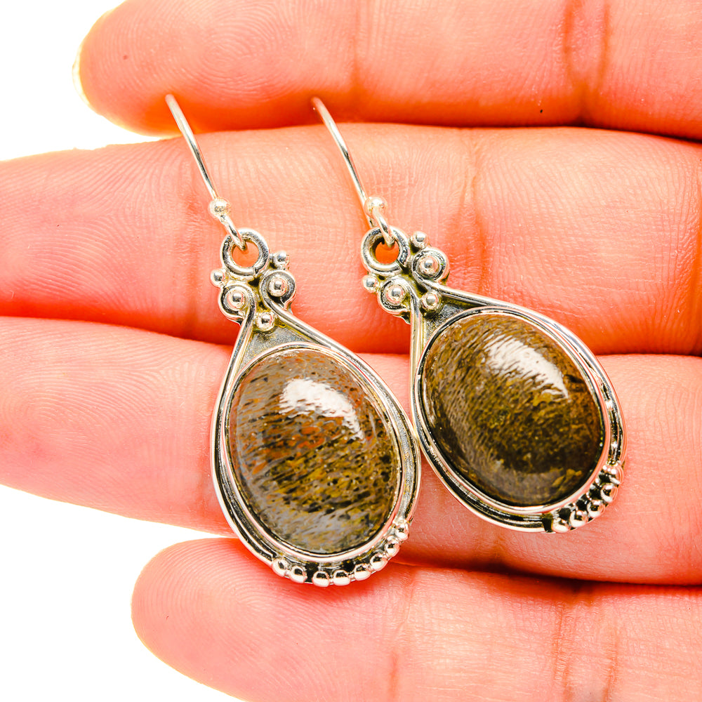 Teardrop stone pendant earrings in silver with mottled gold-green pattern, sterling hooks