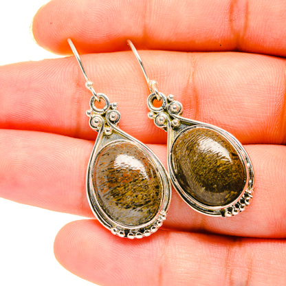Teardrop stone pendant earrings in silver with mottled gold-green pattern, sterling hooks