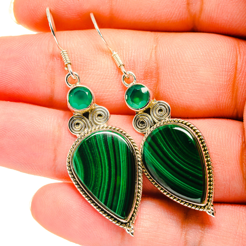 Green malachite-style teardrop earrings with filigree border, round stone accents, and hooks.