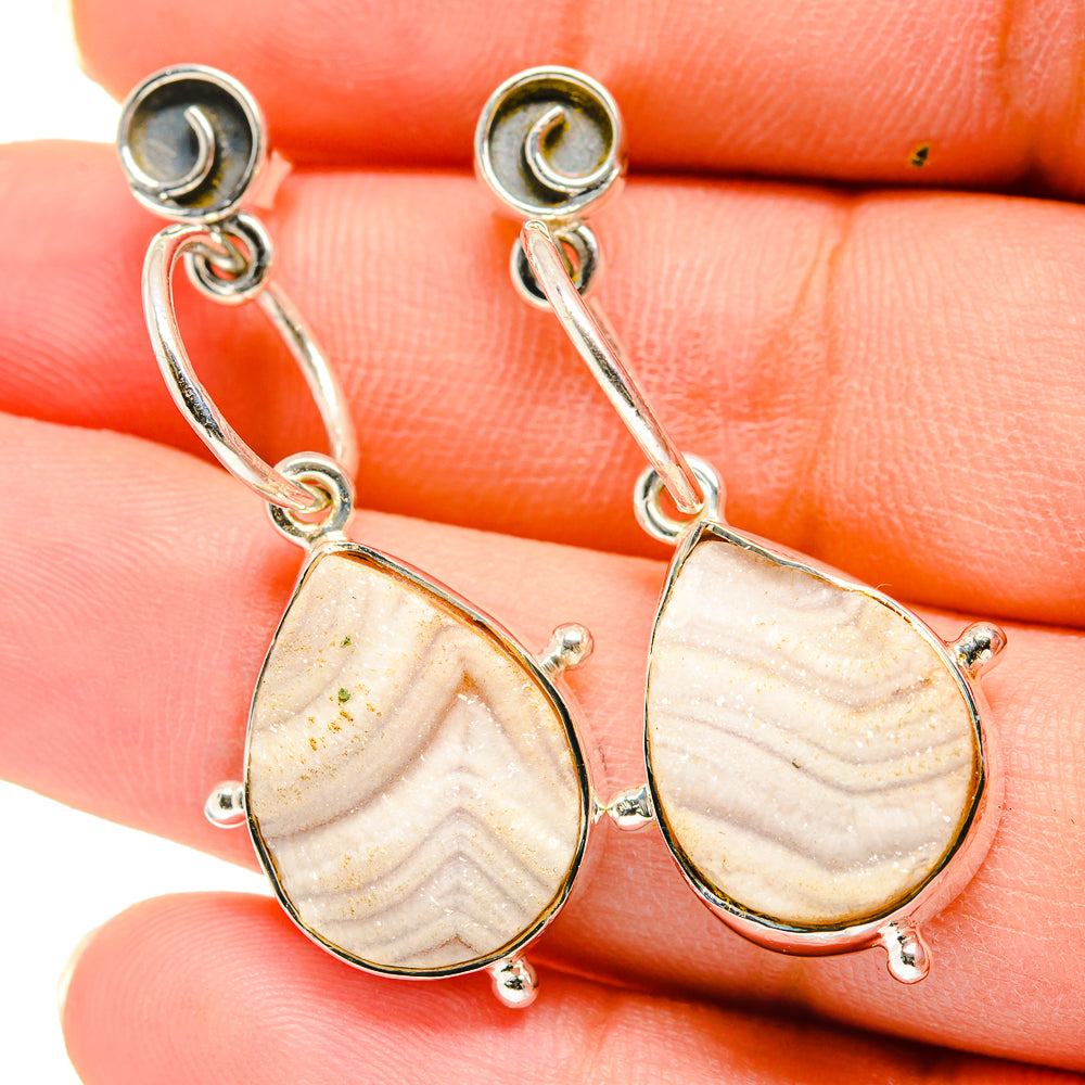 Sterling silver drop earrings with peach druzy teardrop stones on linked dangle hooks