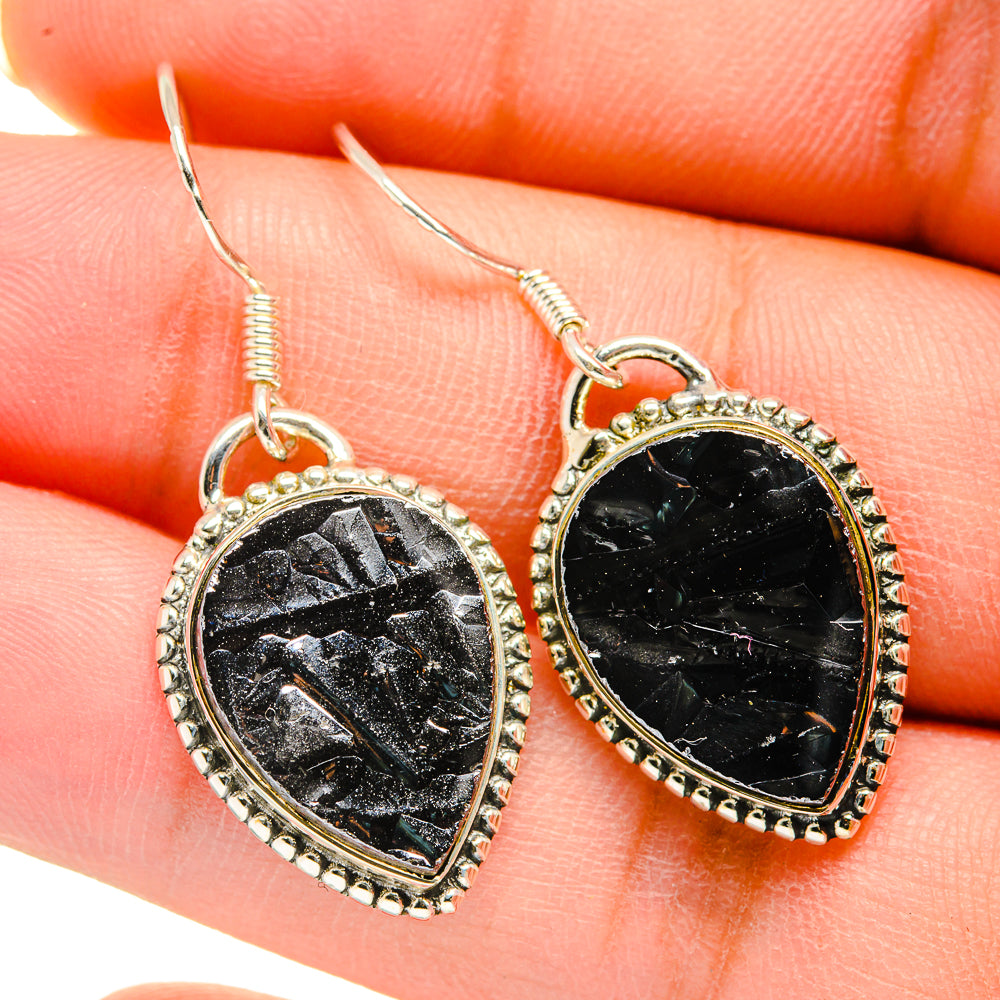 Black rough stone drop earrings in silver-tone bezel, fishhook backs