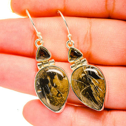 Agate drop earrings with dark gold-speckled teardrop stones and silver hooks