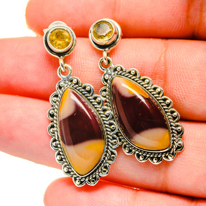 Sterling silver dangle earrings with oval marbled amber and burgundy cabochons