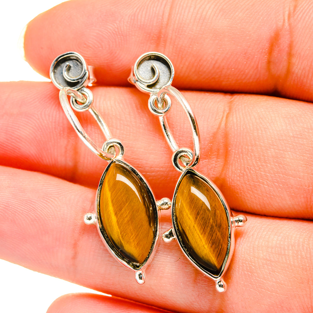Sterling silver hoop earrings with oval tiger eye cabochons in orange-gold
