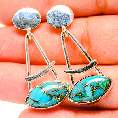 Turquoise oval cabochon drop earrings with sterling silver geometric links