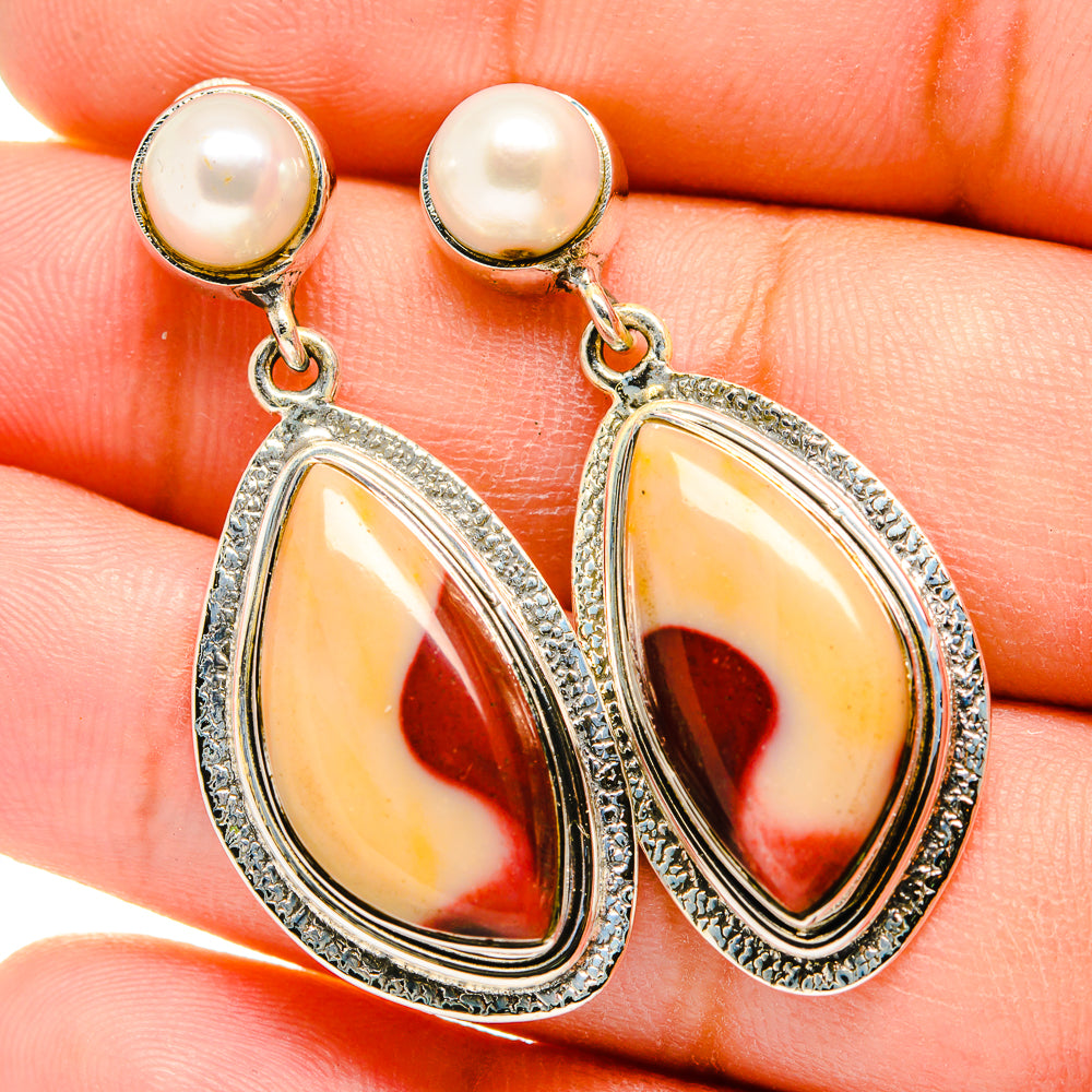 Close-up cultured pearl and mookaite teardrop earrings with sterling silver frames