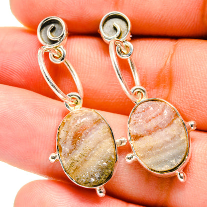 Sterling silver oval druzy stone earrings with orange glitter texture and ear wires