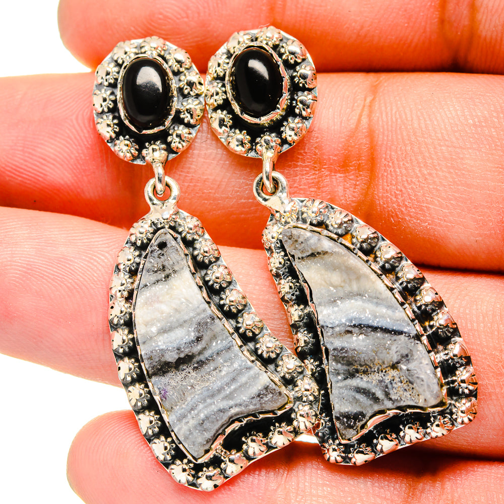 Black onyx stud earrings with dangling gray druzy teardrops in silver-tone settings