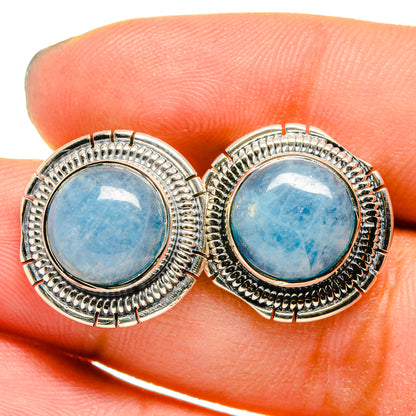 Round aquamarine stud earrings in sterling silver, blue gemstone bezel settings