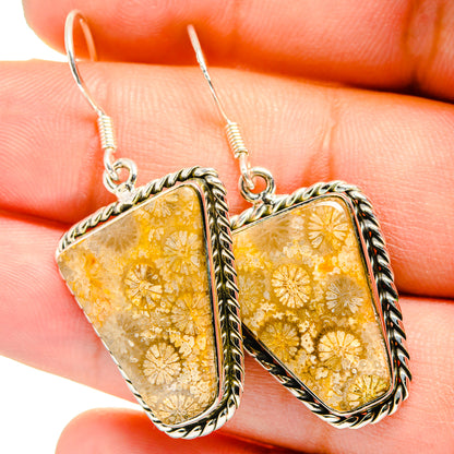 Sterling silver drop earrings with amber-gold resin panels and floral speckle detail