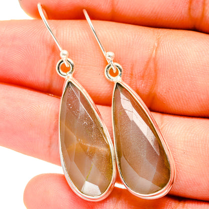 Sterling silver teardrop earrings with faceted amber-brown gemstone drops
