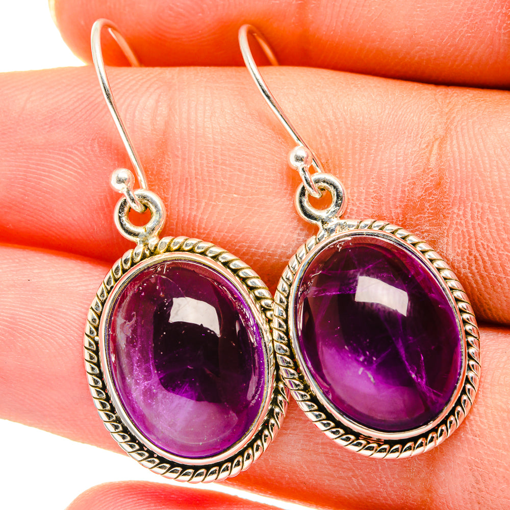 Amethyst oval drop earrings in silver with textured bezel and loop hooks