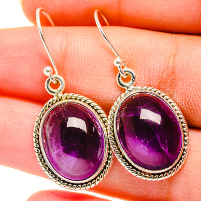 Amethyst oval drop earrings in silver with textured bezel and loop hooks