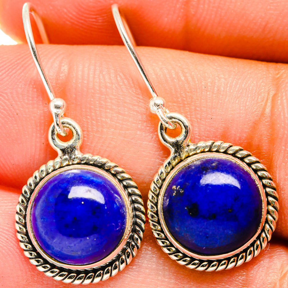 Sterling silver lapis lazuli cabochon earrings, round blue stone with rope border and hooks