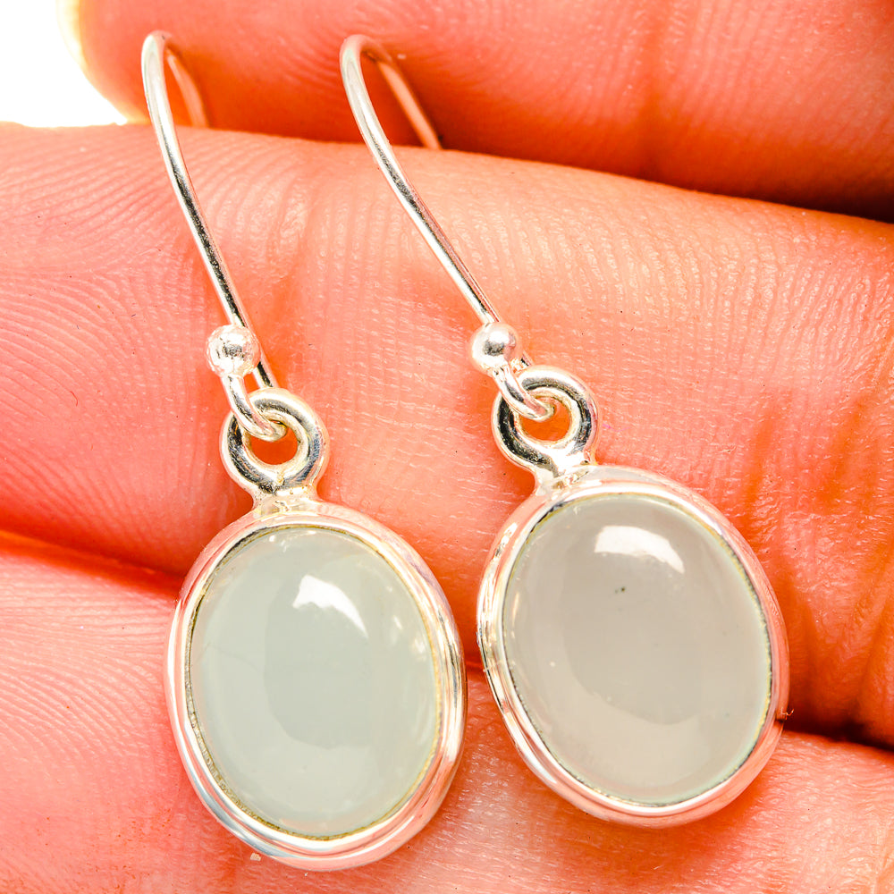 Aquamarine drop earrings with oval pale green stones, sterling silver hooks