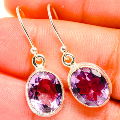 Amethyst faceted oval drop earrings in 925 sterling silver, with round bezel settings.