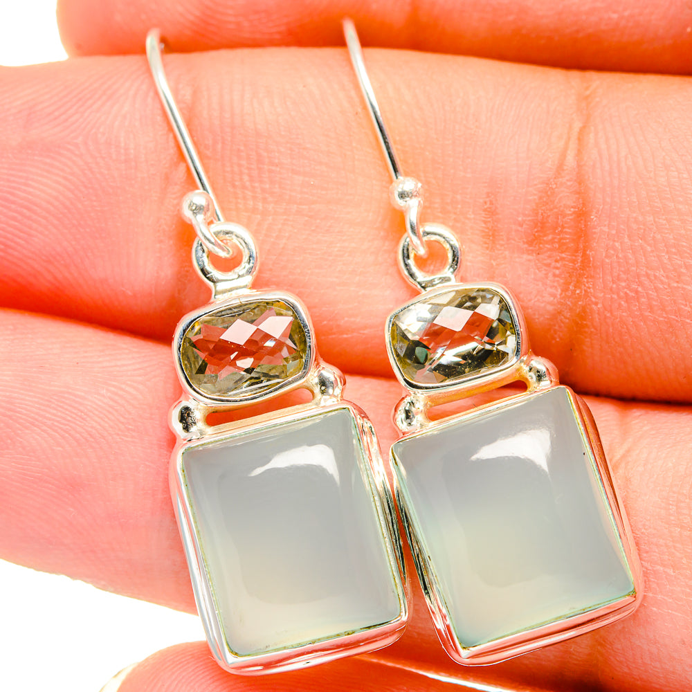Sterling silver earrings with square pale green stones and faceted top