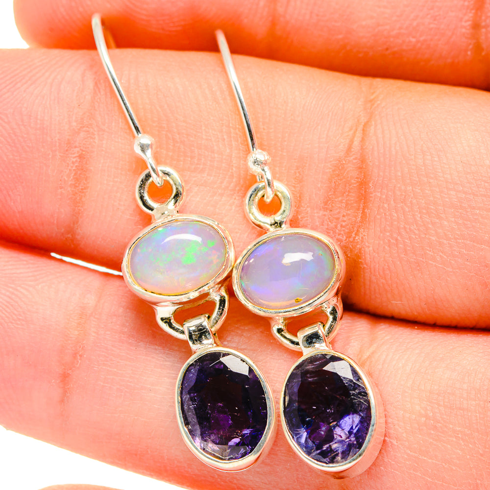 Sterling silver drop earrings with round opal and purple faceted gemstone dangles