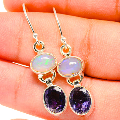 Sterling silver drop earrings with round opal and purple faceted gemstone dangles