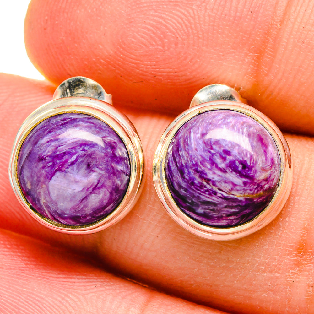 Round purple charoite cabochon stud earrings in 925 sterling silver, close-up