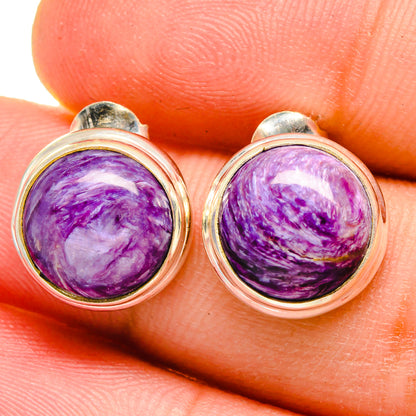 Round purple charoite cabochon stud earrings in 925 sterling silver, close-up