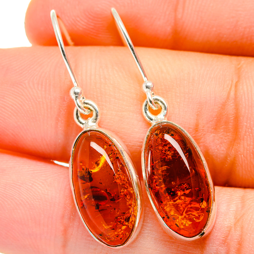 Sterling silver amber oval drop earrings with hook backs and polished amber cabochons
