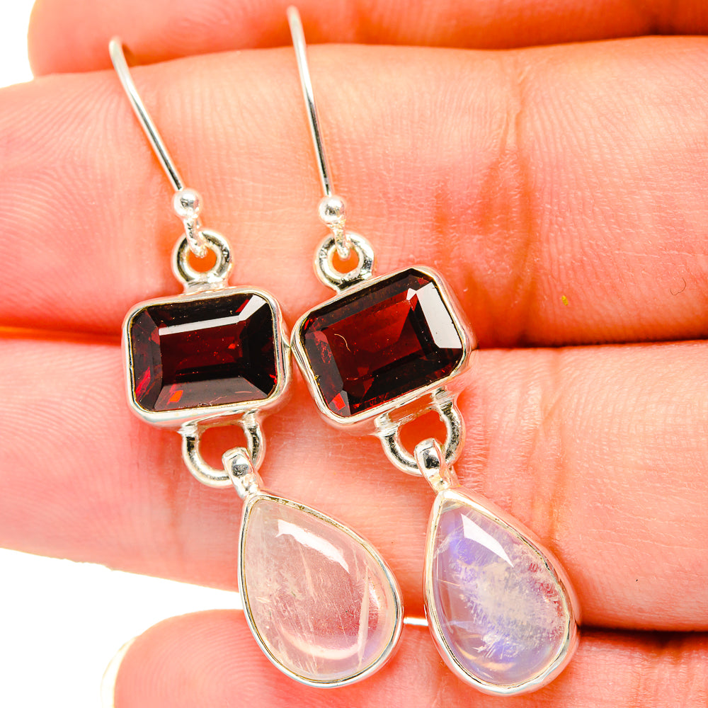 Sterling silver earrings with faceted square red garnet and pear rainbow moonstone dangles