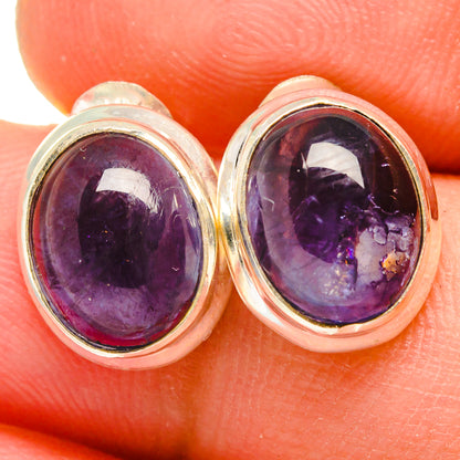 Oval tanzanite stud earrings in 925 sterling silver with purple gemstone bezel
