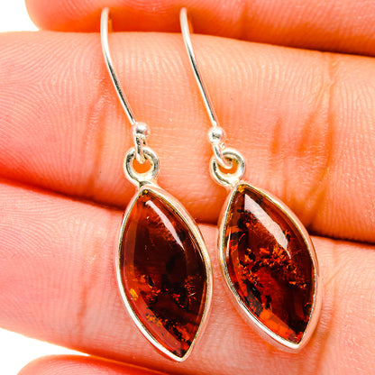 Amber teardrop earrings with sterling silver hooks and marbled amber stones
