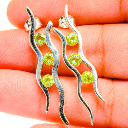 925 sterling silver peridot earrings, wavy drop design with green gemstone accents