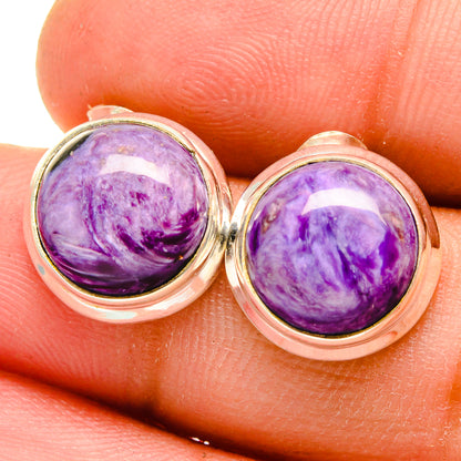 Rose-gold tone stud earrings with round purple charoite cabochons