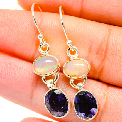 Sterling silver opal and tanzanite drop earrings, pale opal and dark purple oval stones